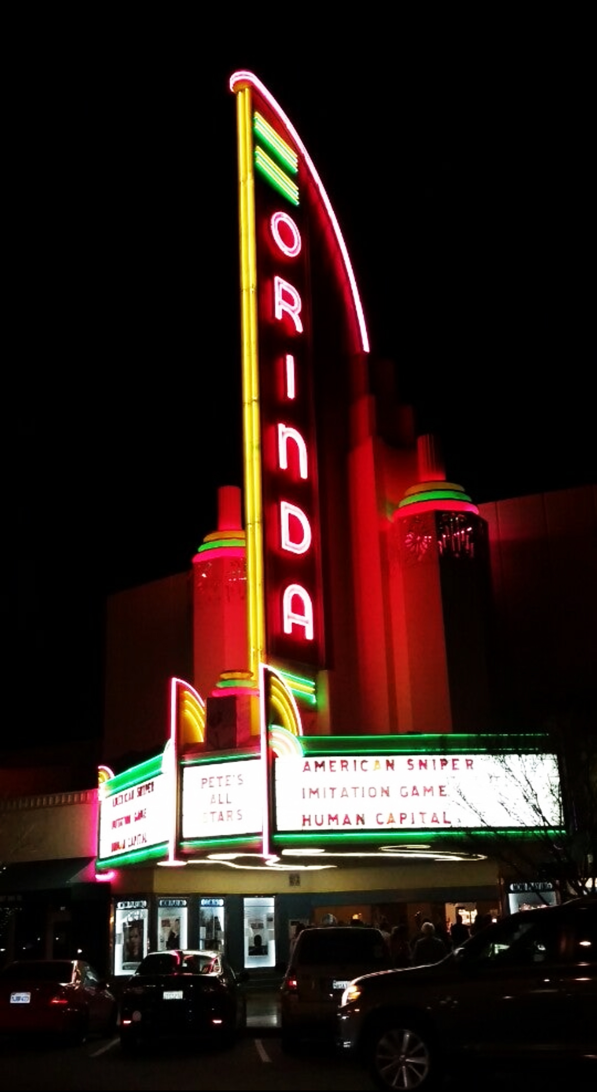 The Orinda Theatre’s neon marquee tower lit at night